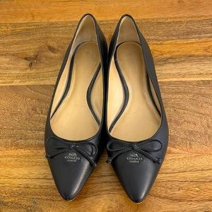 COACH black leather flats.